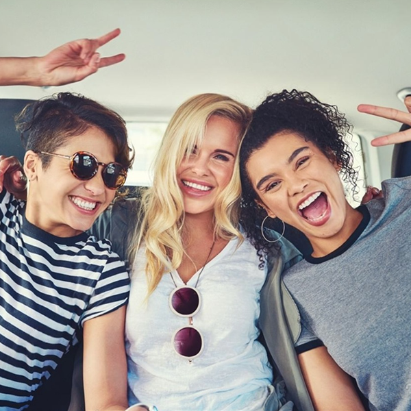 A group of happy tourists enjoying a guided transfer experience with a professional guide.
